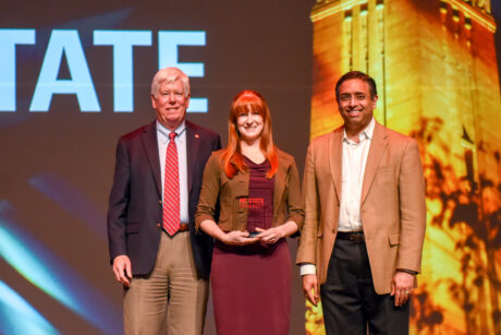 Company receiving award on stage