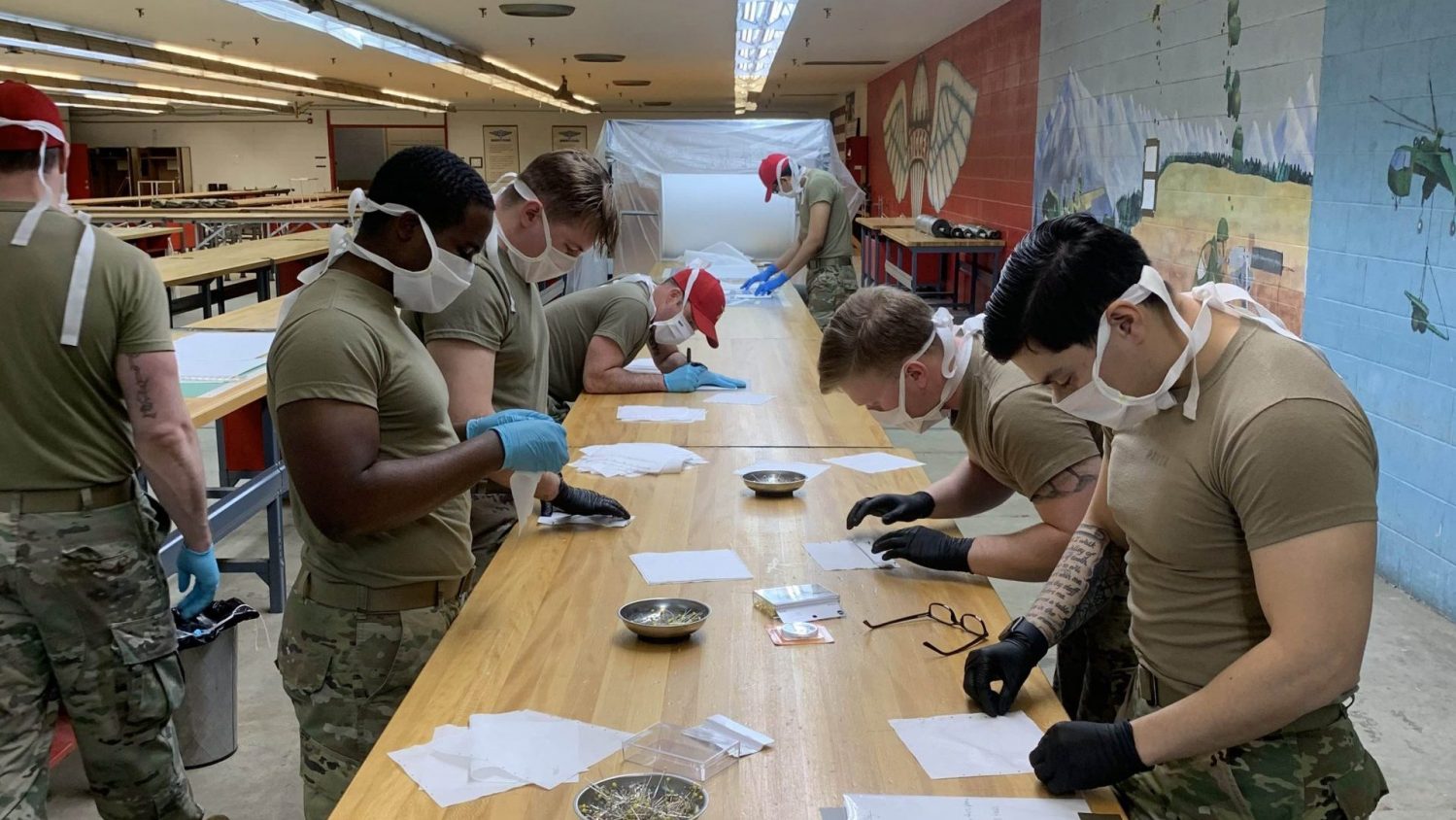 soldiers sew protective masks