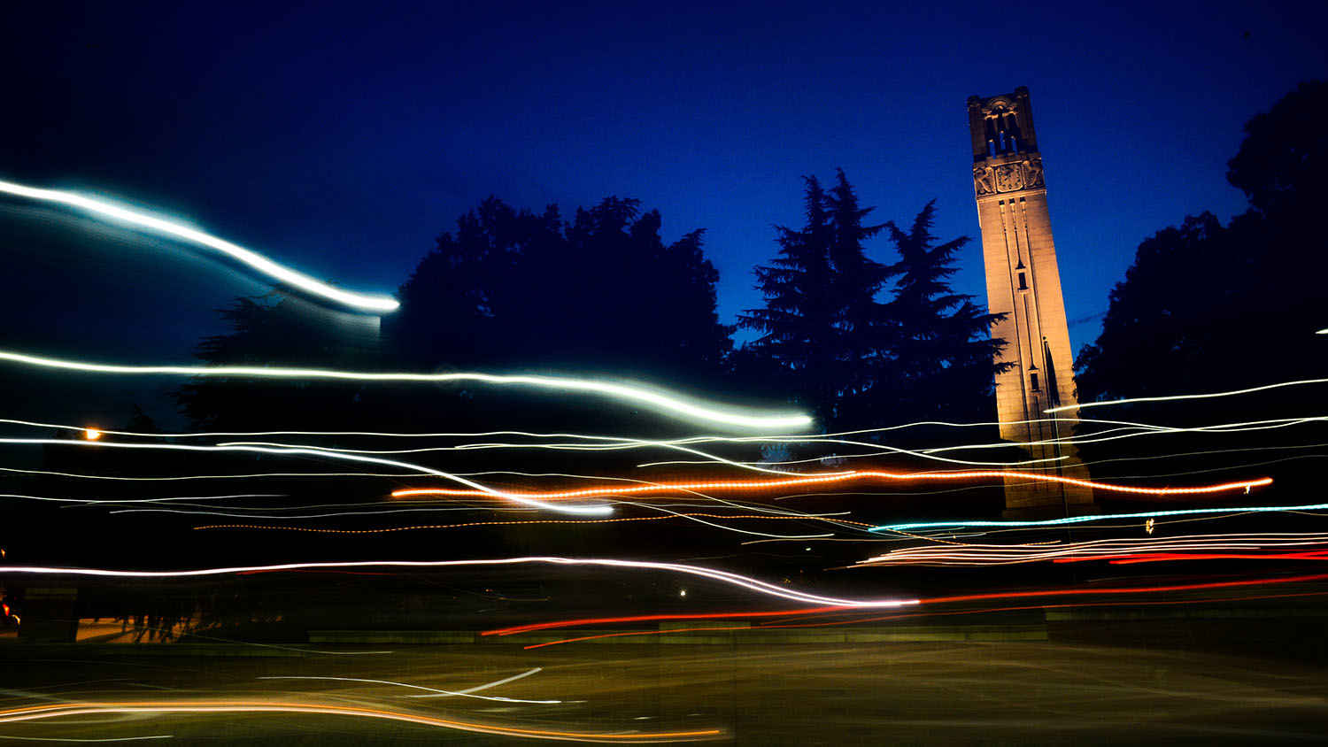 The NC State Belltower at dusk and night. Photo by Marc Hall