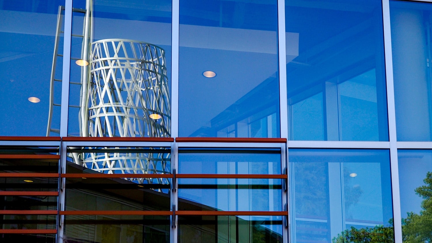 The Technology Tower is reflected in the side windows of the Talley Student Center.
