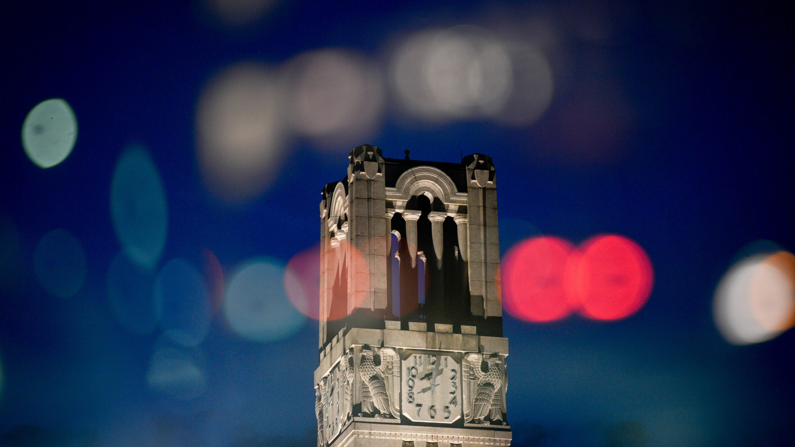 The NC State Belltower at dusk and night. Photo by Marc Hall