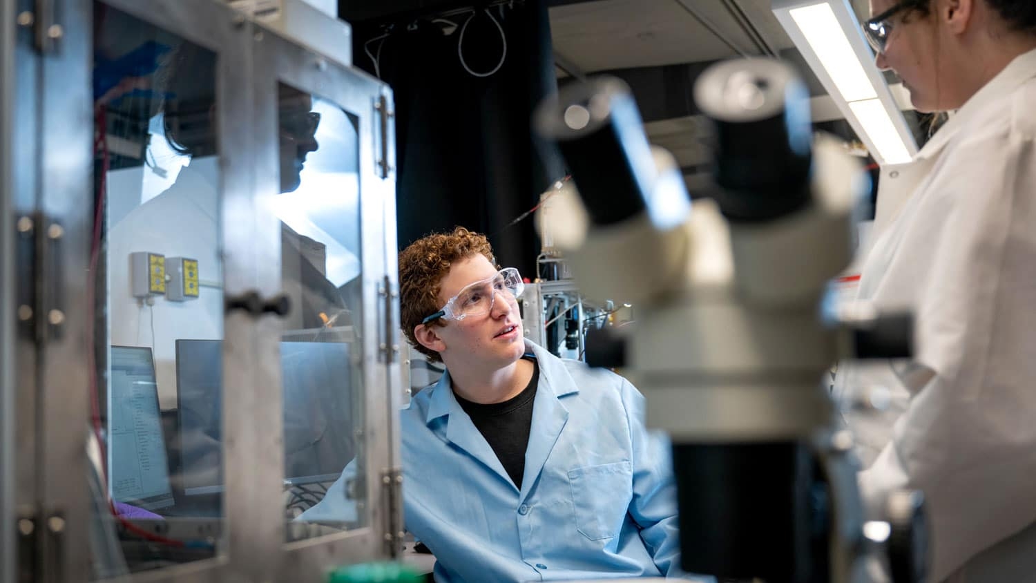 Adam Nahor and Sierra Hunter working in a chemistry lab at NC State