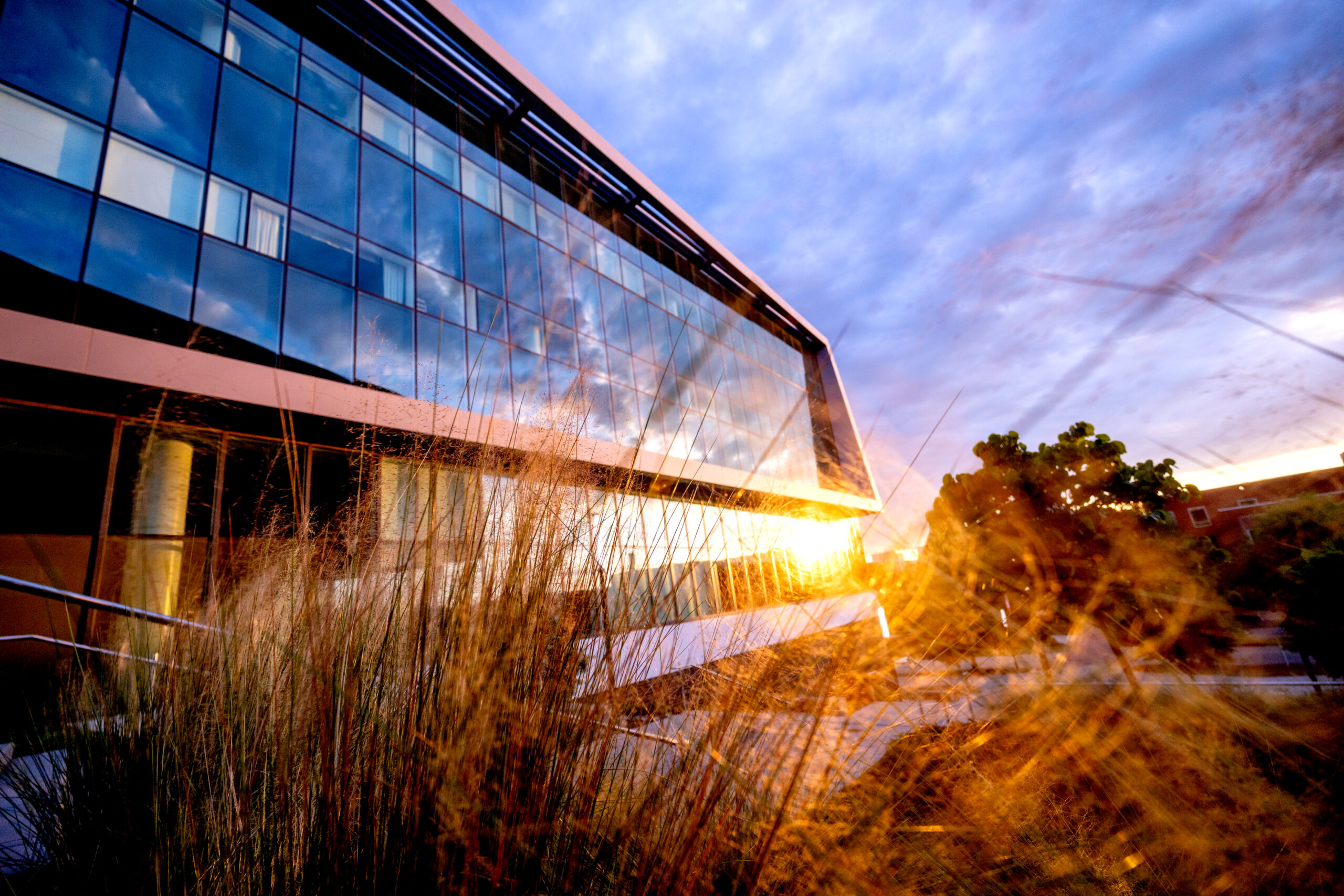 The sun sets on a warm summer evening on Centennial Campus at the Hunt Library.