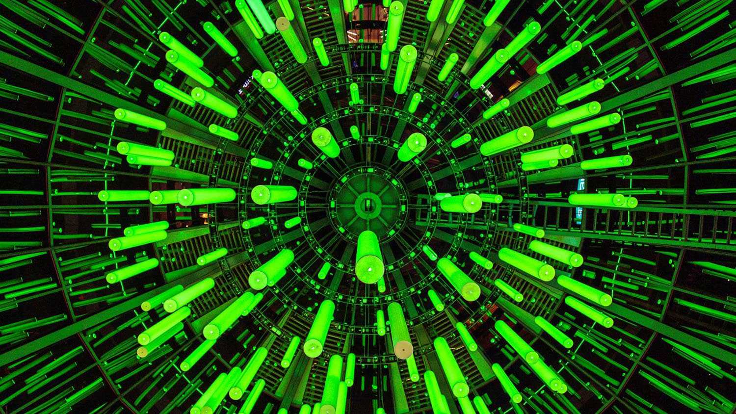 Computerized image of layered hybrid perovskites (LHPs) down to the atomic level. Image shows light green rods radiating outward from a spherical shape on a dark green background.